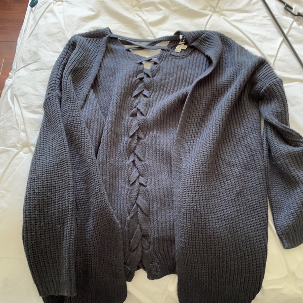 Navy blue sweater! With crisscross on the back.